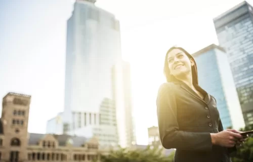 How Digital Mail Can Help - Woman walking with skyline behind