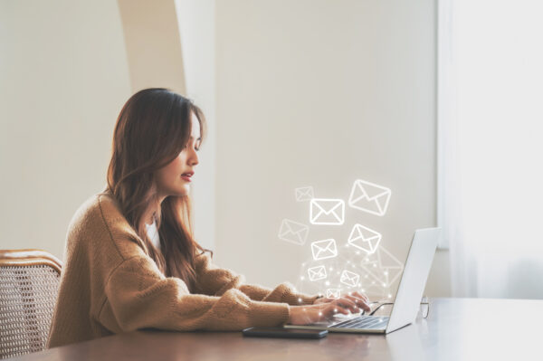 Mail handling - woman at laptop with digital mail